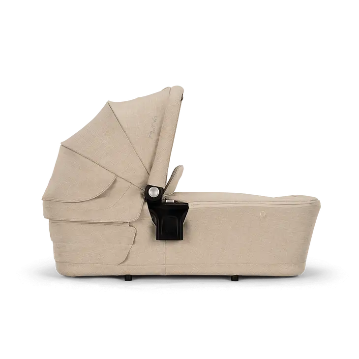 Navicella LYTL NUNA beige con capottina UPF 50+, chiusura compatta e maniglia ecopelle per passeggini Nuna.