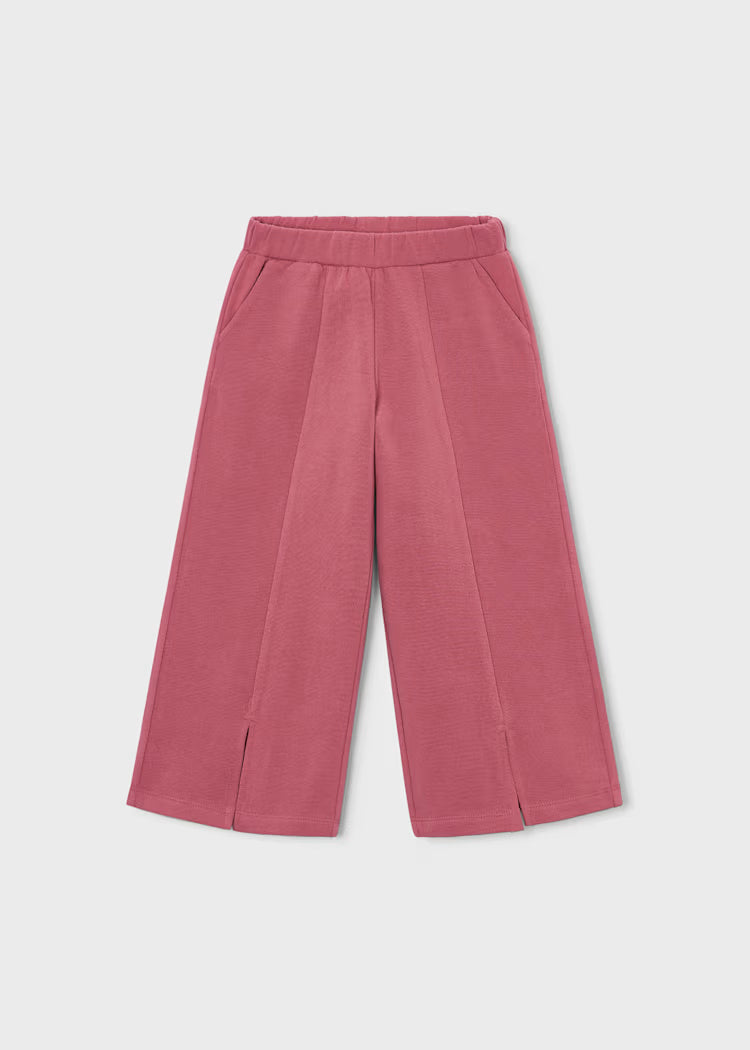 Pantaloni rosa in tessuto morbido con fascia elastica in vita e piccole aperture sul fondo, parte della TUTA 3PZ STELLINE.